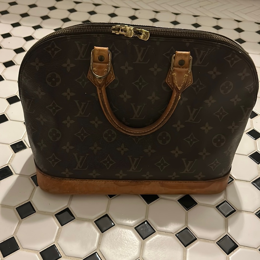 Well used authentic Louis Vuitton bag
